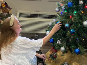 happy wood ridge residents decorating christmas tree